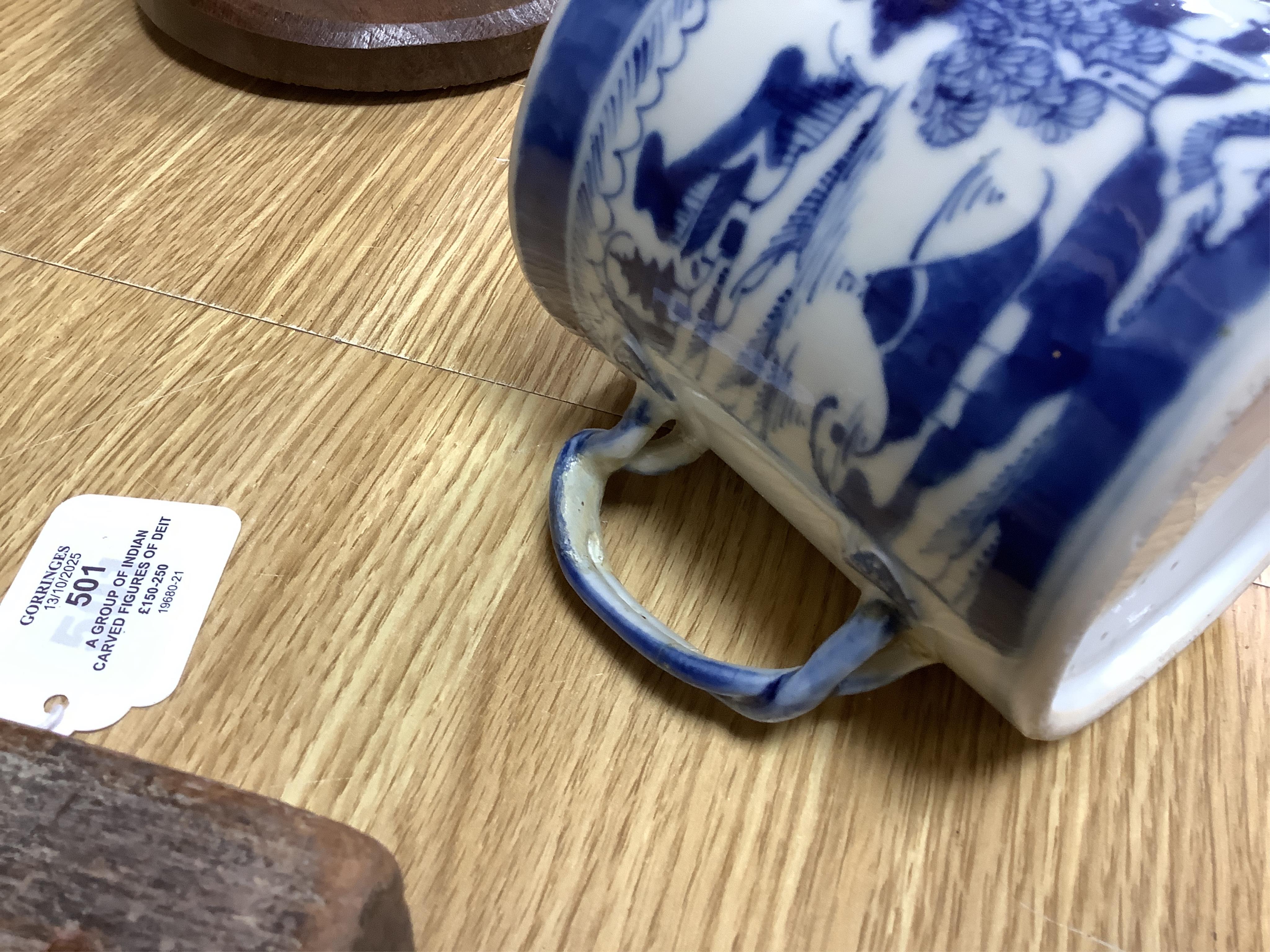 A collection of Chinese ceramics to include a blue and white mug, set of three graduated Canton jars and covers and two cylindrical brush washers